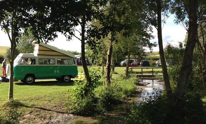 Campervan by stream